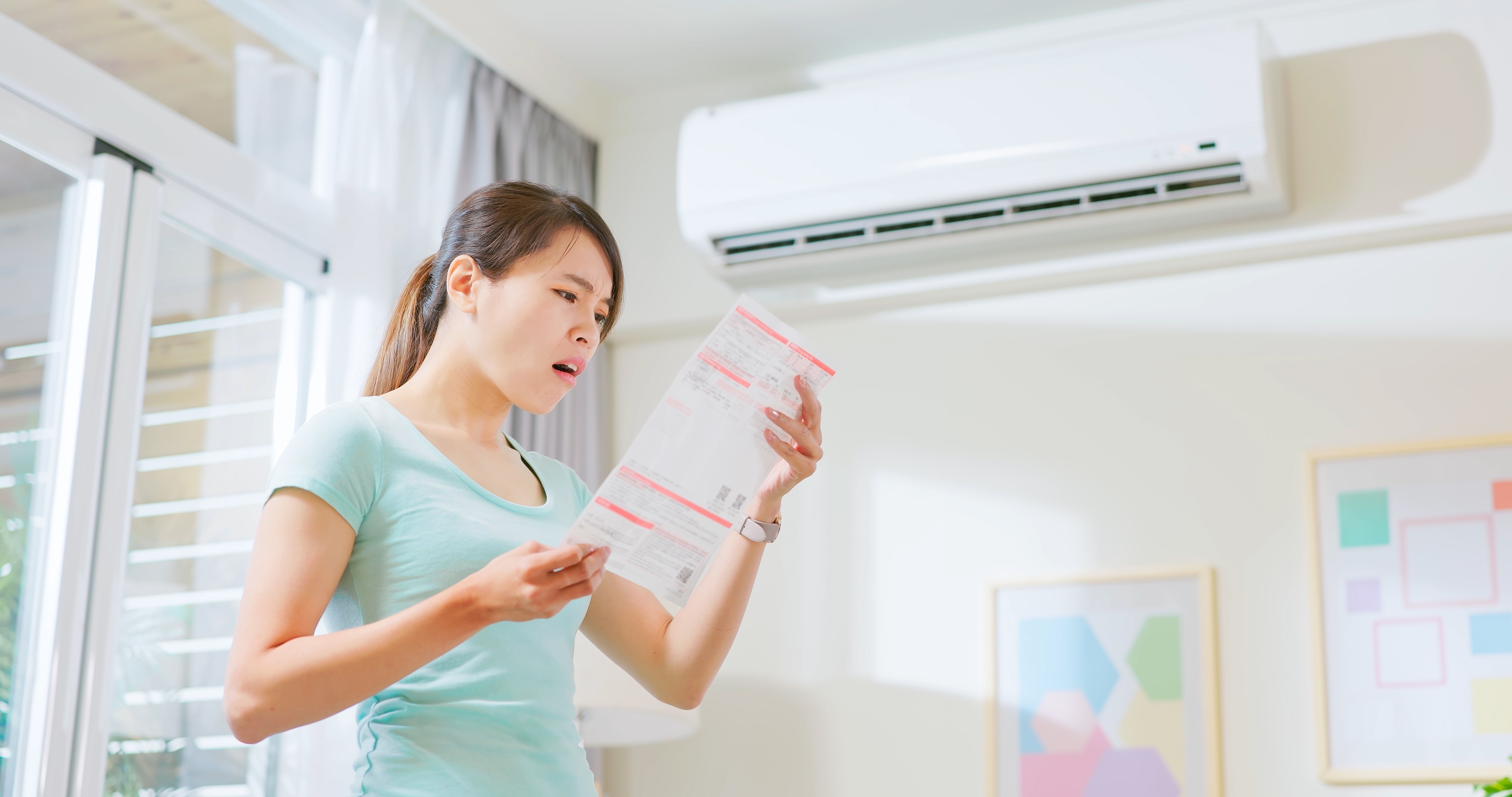Asian,Woman,Stand,By,Air,Conditioner,Shocked,And,Upset,About